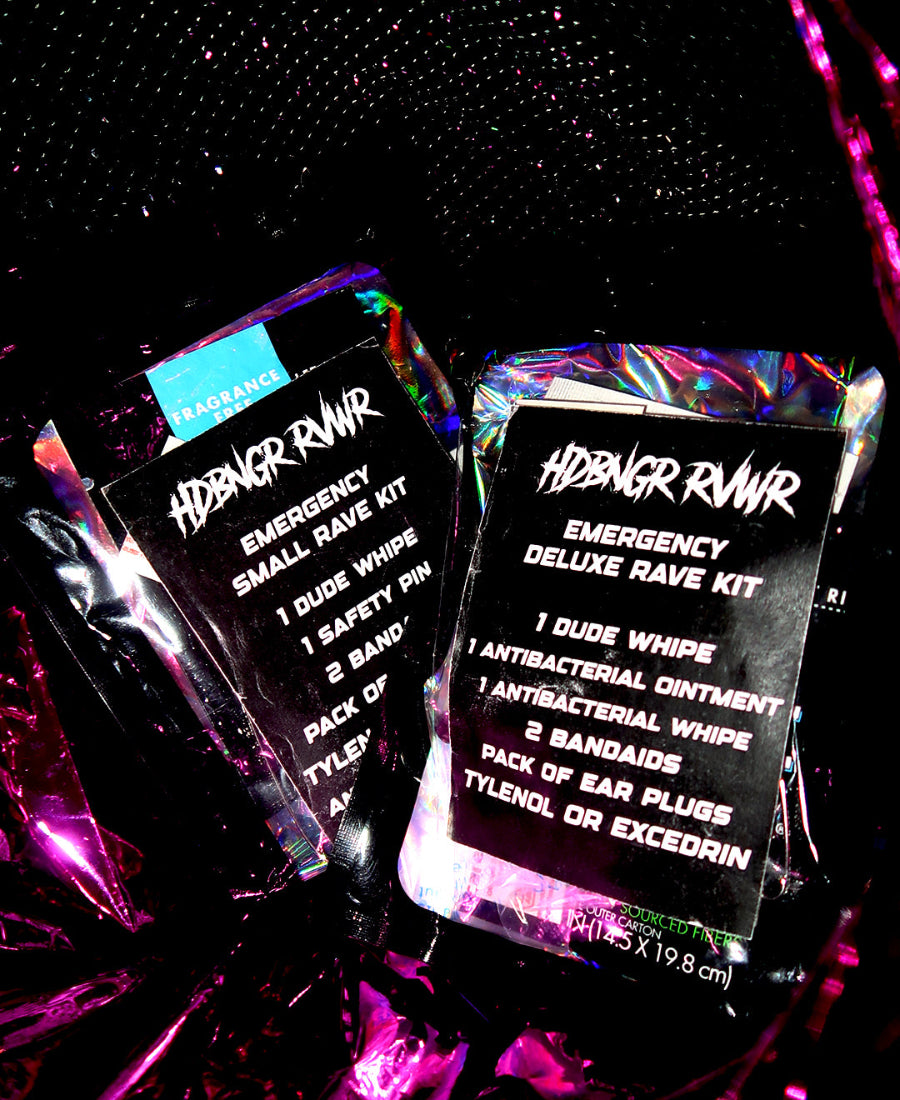 Emergency rave kits with holographic packaging on a dark background