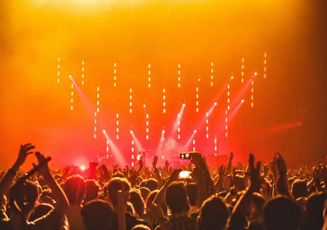 First-time raver enjoying colorful lights at an electronic music festival