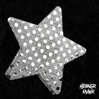 Single silver sequin star-shaped pastie with mirror dot embellishment on dark textured background — Silver Stars by HDBNGR RVWR.