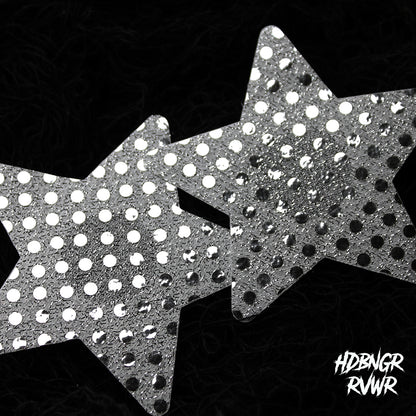 Pair of silver sequin star-shaped pasties overlapping on dark background — Silver Stars 2PC by HDBNGR RVWR.