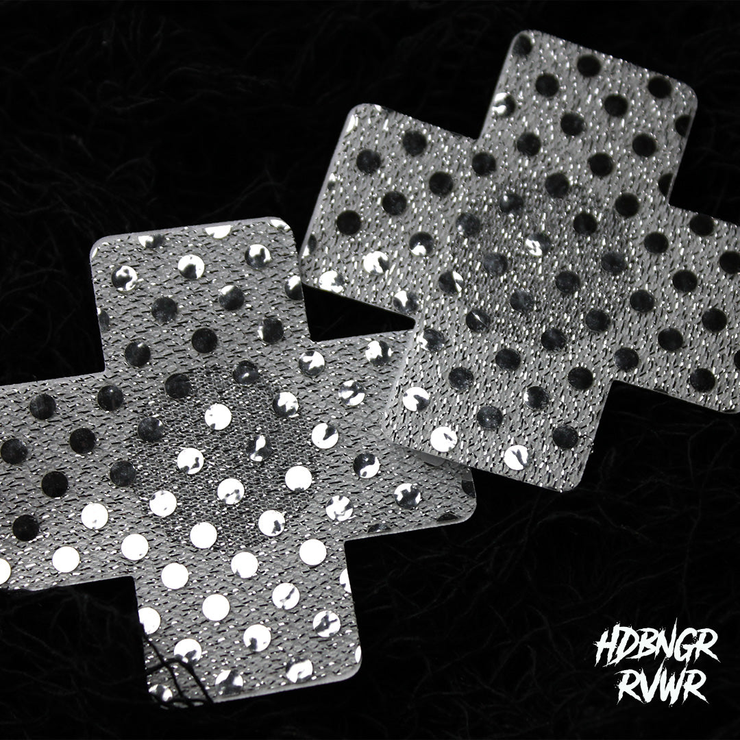 Pair of silver sequin cross-shaped pasties with mirror dots overlapping on dark background — Silver Xs 2PC by HDBNGR RVWR.