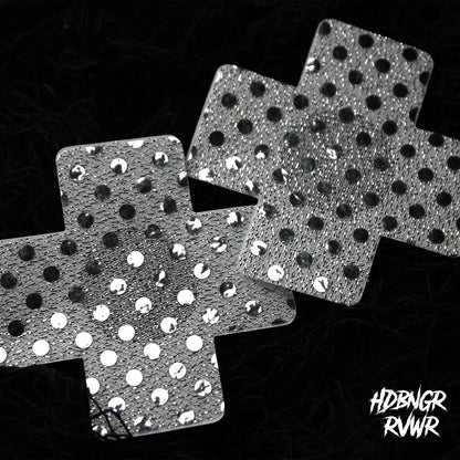 Pair of silver sequin cross-shaped pasties with mirror dots overlapping on dark background — Silver Xs 2PC by HDBNGR RVWR.