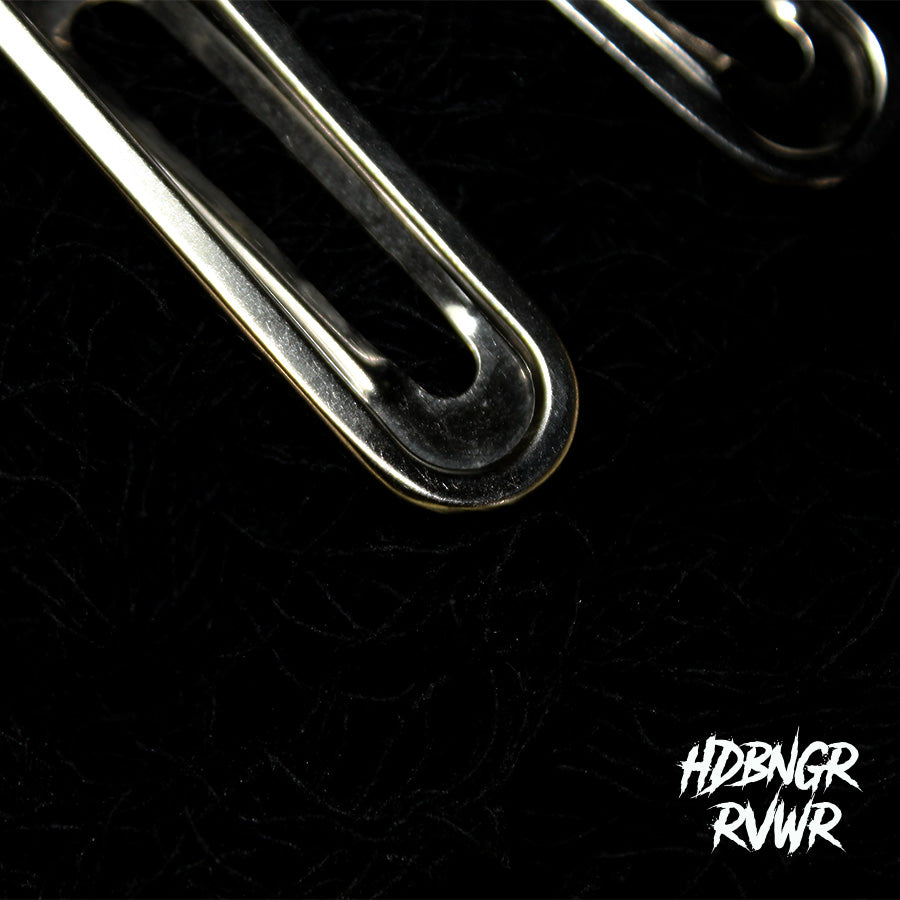 Two silver paperclip-shaped hair clips on dark textured background — Y2K Paperclip V1 by HDBNGR RVWR.