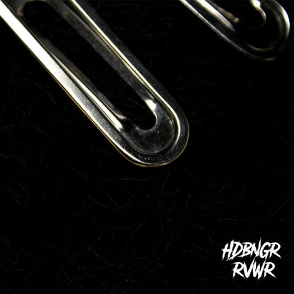 Two silver paperclip-shaped hair clips on dark textured background — Y2K Paperclip V1 by HDBNGR RVWR.