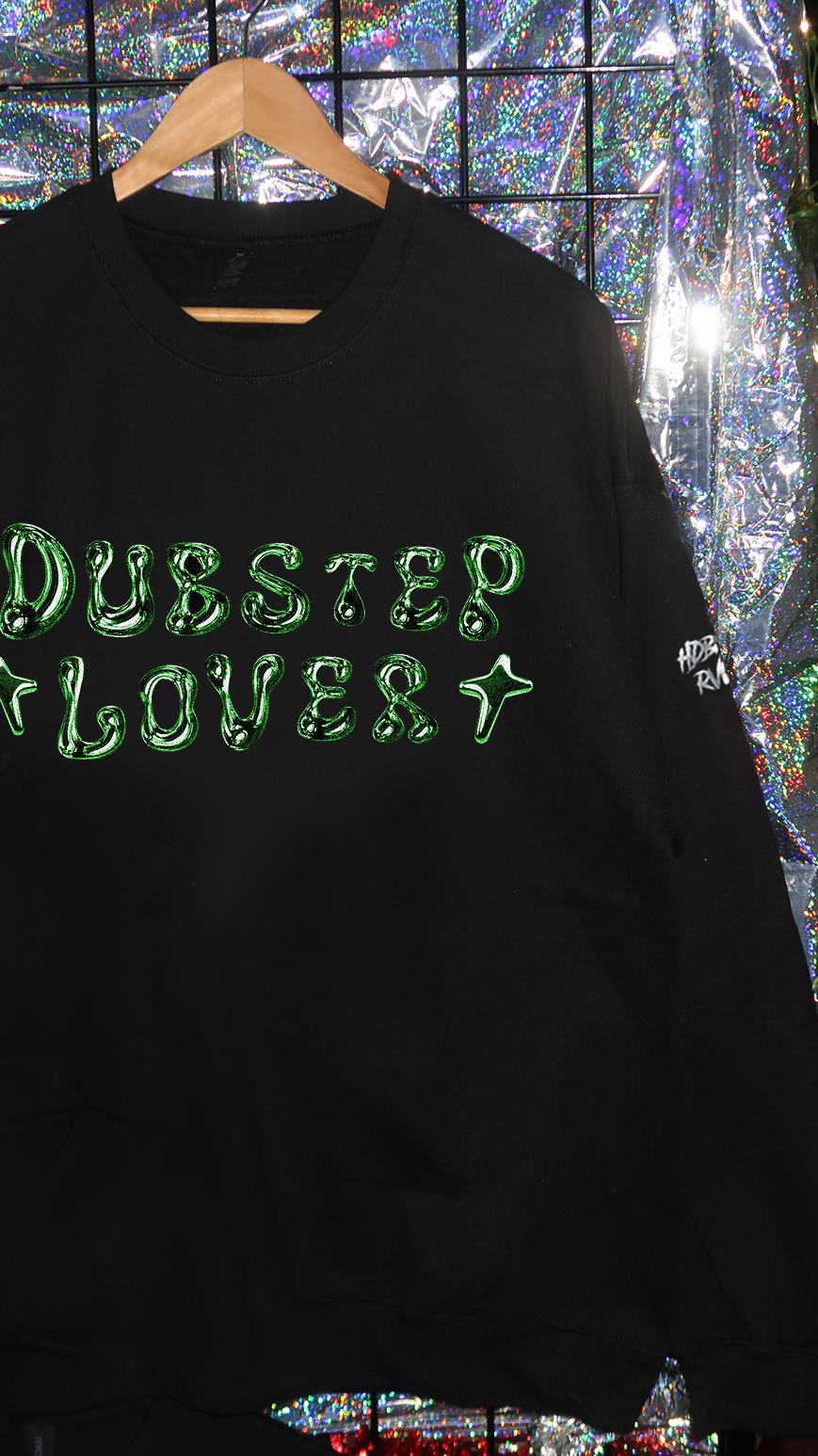 Black sweatshirt with 'Dubstep Lover' text in green on a reflective surface background