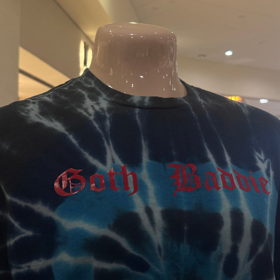 Tie-dye shirt with red text on a blurred background